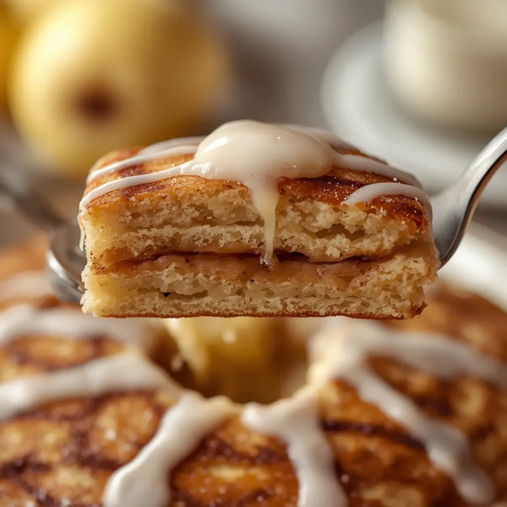 nancy-cinnamon-roll-pancakes: Nancy's cinnamon roll pancakes with sweet swirls, gooey filling, and icing drizzle on a warm stack.