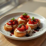 balsamic strawberry toast: : Balsamic strawberry toast with goat cheese and basil garnish