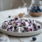 blueberry greek yogurt bites: : Blueberry greek yogurt bites in a muffin tin, a healthy frozen snack.