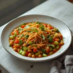 fresh indian chaat salad: : Fresh Indian chaat salad with crispy sev and chickpeas in a colorful bowl