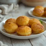 perfect duchess potatoes: : Golden brown perfect duchess potatoes piped in elegant rosettes.