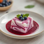 blueberry swirl yogurt bites: : Blueberry swirl yogurt bites on a tray showing purple and white marbled pattern