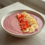 strawberry banana smoothie bowl: : Strawberry banana smoothie bowl with fresh toppings in a bowl