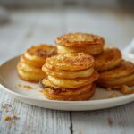 potato stacks with garlic herb butter plated and served on a table