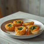 Spinach and artichoke stuffed shrimp arranged beautifully as a holiday appetizer, showing golden edges and a creamy filling.